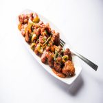 indian-starter-chilli-chicken-served-plate-selective-focus_466689-32149